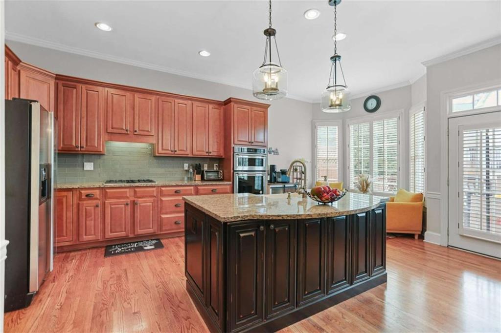 4712 Ivy Ridge Drive Southeast Atlanta, GA 30339 - Photo 19 of 82 a kitchen with granite countertop a sink appliances and cabinets