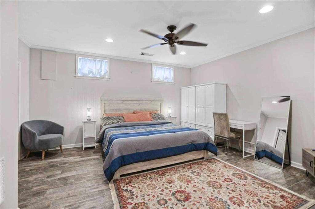 4712 Ivy Ridge Drive Southeast Atlanta, GA 30339 - Photo 26 of 82 a bedroom with a bed and a chair