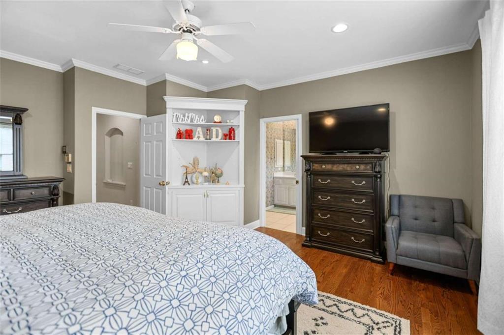 4712 Ivy Ridge Drive Southeast Atlanta, GA 30339 - Photo 33 of 82 a spacious bedroom with a bed and a flat screen television