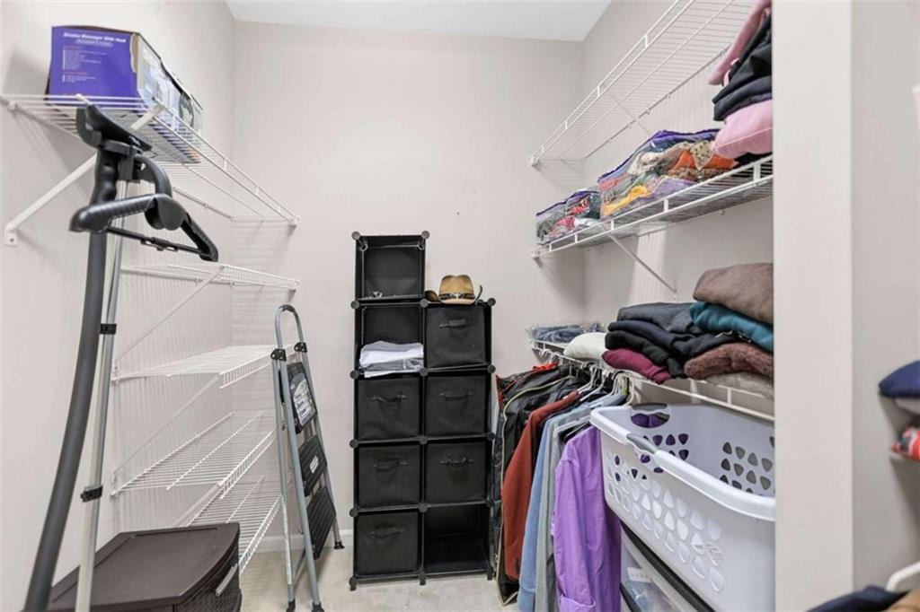 4712 Ivy Ridge Drive Southeast Atlanta, GA 30339 - Photo 39 of 82 a view of walk in closet with clothes and shoes