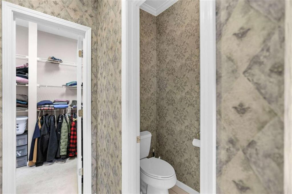 4712 Ivy Ridge Drive Southeast Atlanta, GA 30339 - Photo 40 of 82 a bathroom with a shower and a toilet