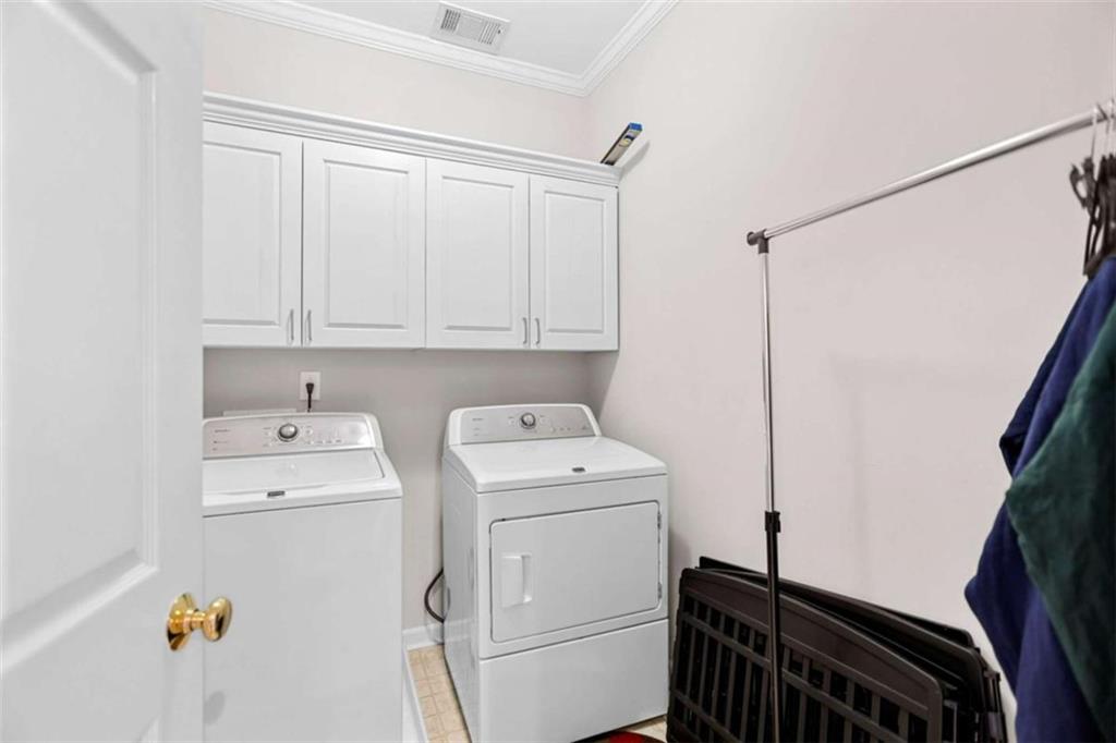 4712 Ivy Ridge Drive Southeast Atlanta, GA 30339 - Photo 42 of 82 a utility room with dryer and washer