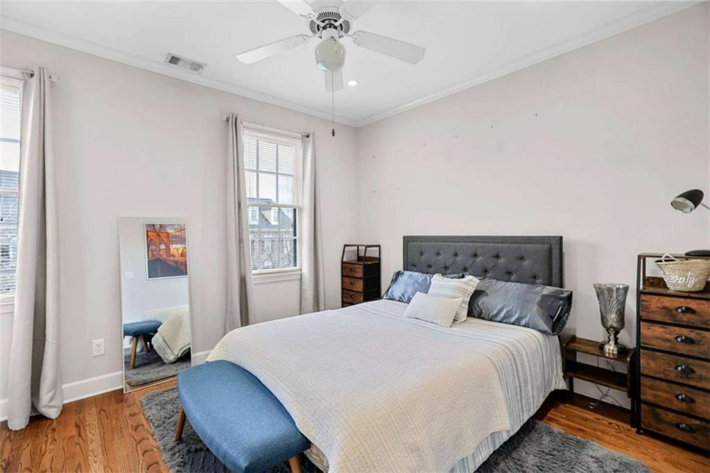 4712 Ivy Ridge Drive Southeast Atlanta, GA 30339 - Photo 43 of 82 a bedroom with a bed and wooden floor