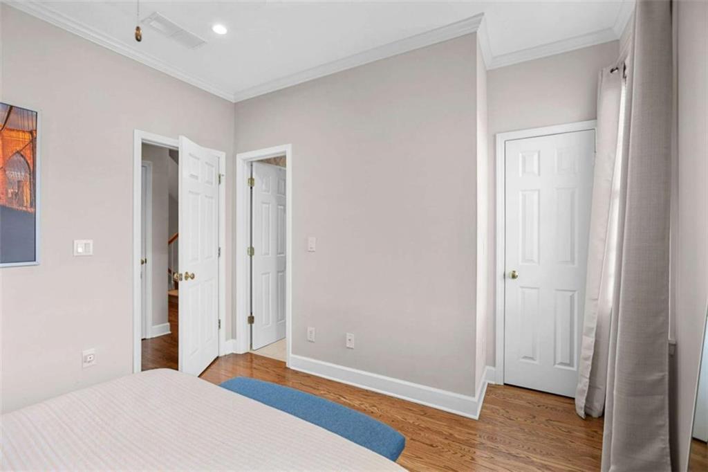 4712 Ivy Ridge Drive Southeast Atlanta, GA 30339 - Photo 44 of 82 a bedroom with a bed and wooden floor