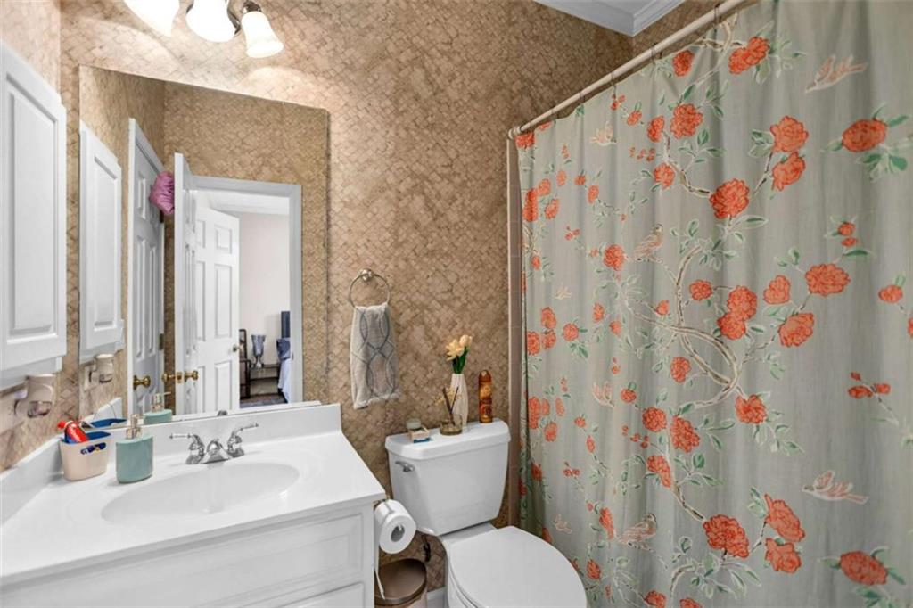 4712 Ivy Ridge Drive Southeast Atlanta, GA 30339 - Photo 45 of 82 a bathroom with a sink toilet and shower