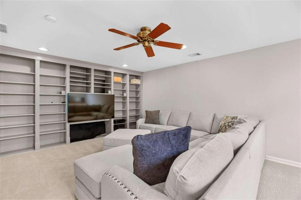 4712 Ivy Ridge Drive Southeast Atlanta, GA 30339 - Photo 47 of 82 a living room with furniture and a flat screen tv