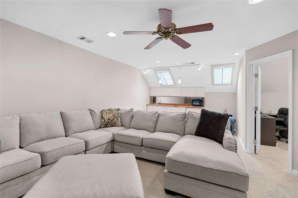 4712 Ivy Ridge Drive Southeast Atlanta, GA 30339 - Photo 50 of 82 a living room with furniture and a view