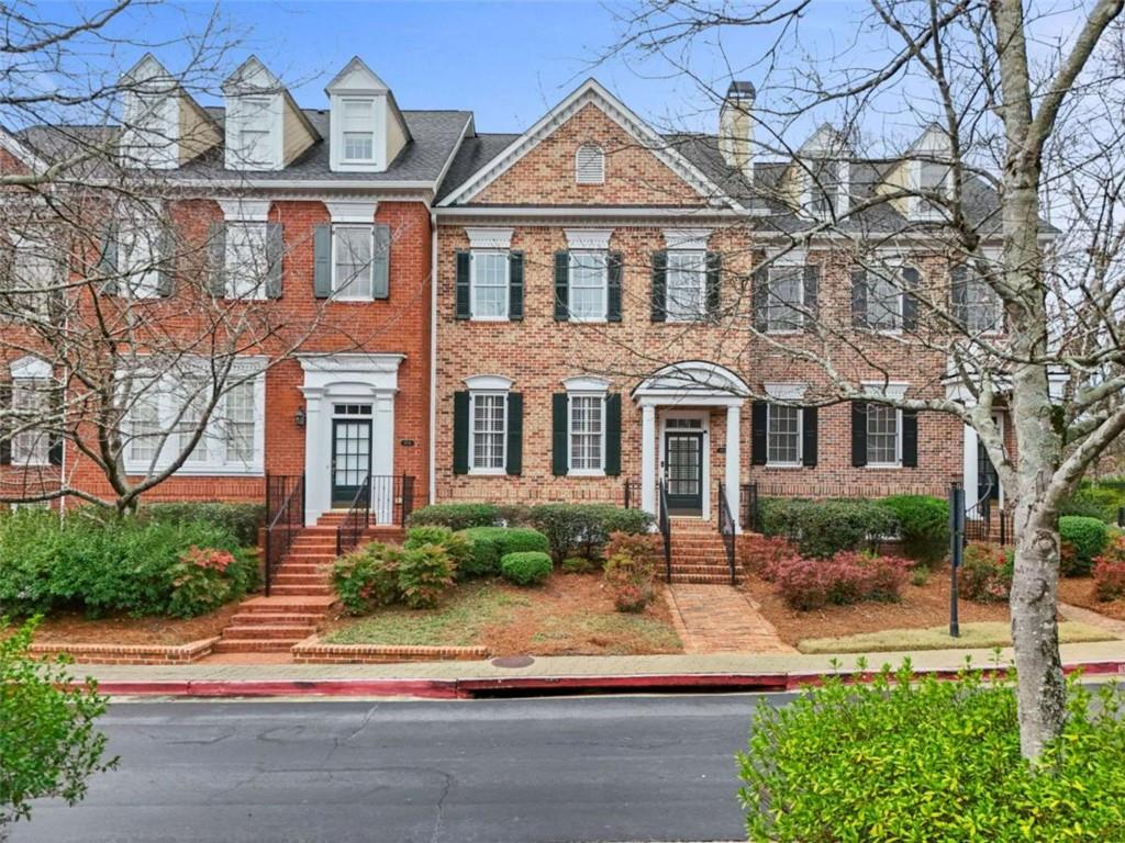 4712 Ivy Ridge Drive Southeast Atlanta, GA 30339 - Photo 5 of 82 a front view of a house with a yard and potted plants