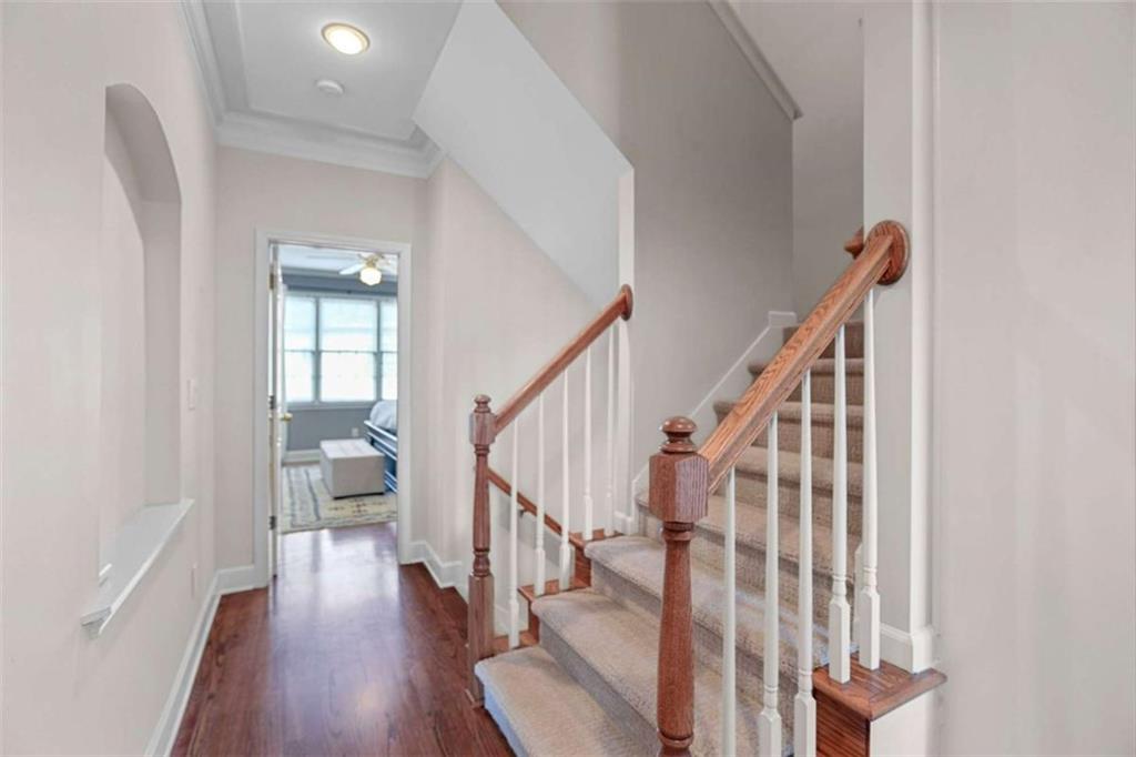 4712 Ivy Ridge Drive Southeast Atlanta, GA 30339 - Photo 53 of 82 a view of a hallway with wooden floor and stairs
