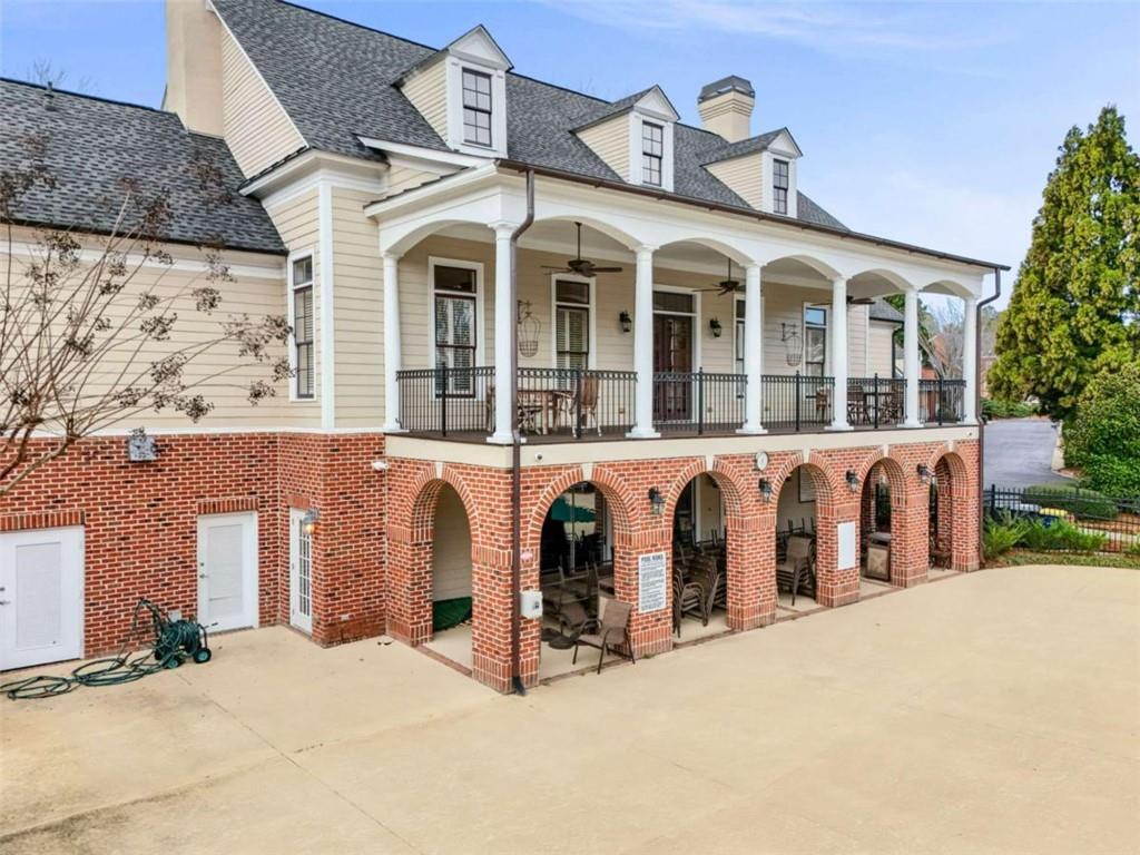 4712 Ivy Ridge Drive Southeast Atlanta, GA 30339 - Photo 70 of 82 a view of a white building with large windows