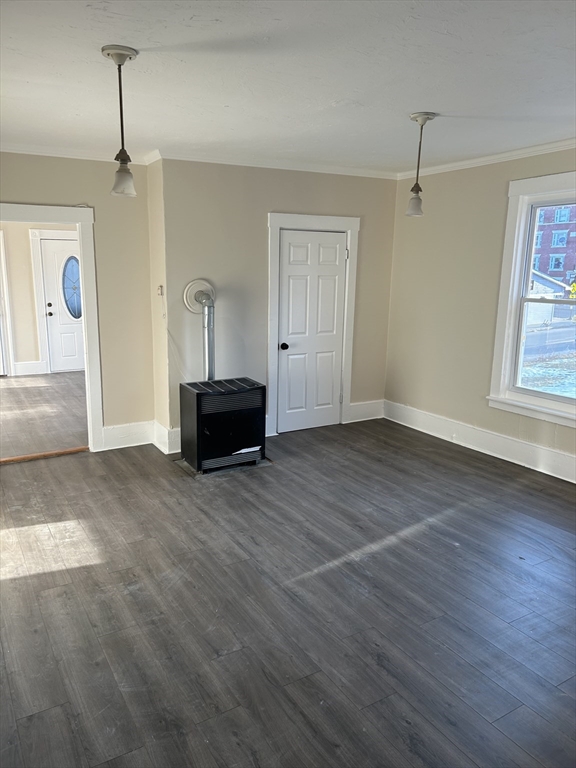 230 Pleasant Street, Unit 2 Worcester, MA 01609 - Photo 5 of 9 a living room with a mirror and furniture
