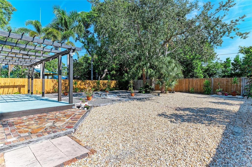 401 27th Street West Bradenton, FL 34205 - Photo 54 of 65 a view of a backyard with a tree