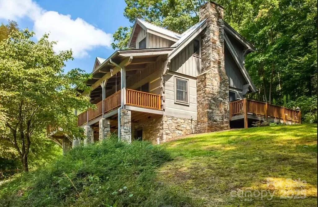 113 Mountain Cove Road Waynesville, NC 28786 - Photo 1 of 48 a view of a house with a yard