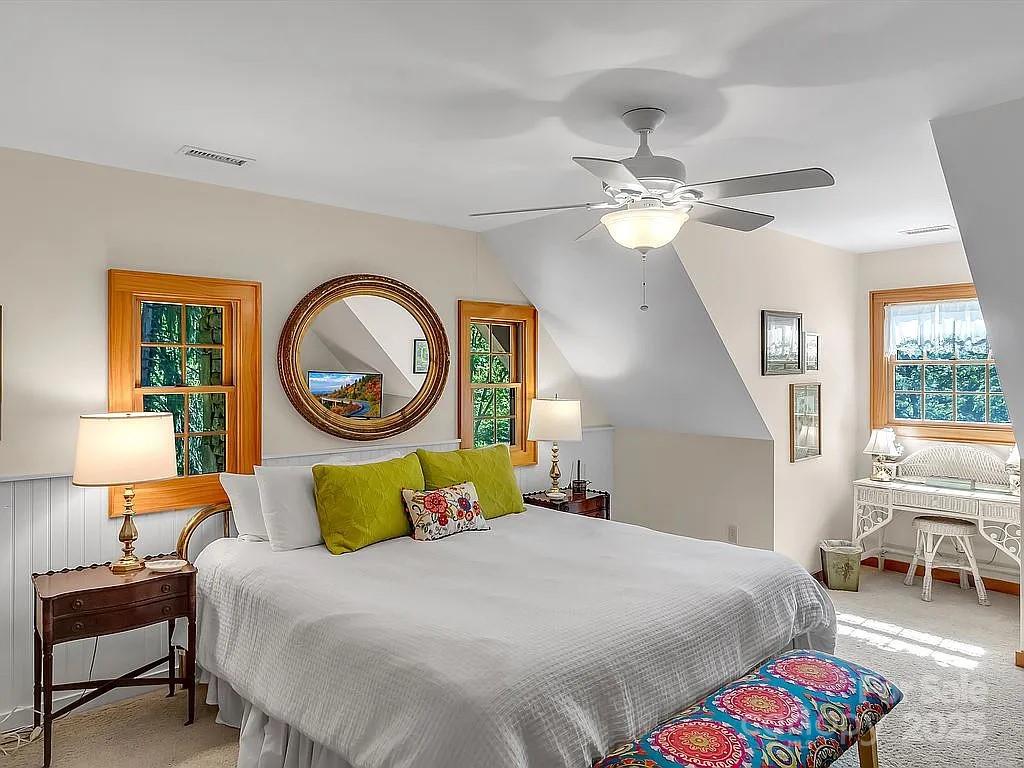 113 Mountain Cove Road Waynesville, NC 28786 - Photo 14 of 48 a bedroom with a bed furniture and a window