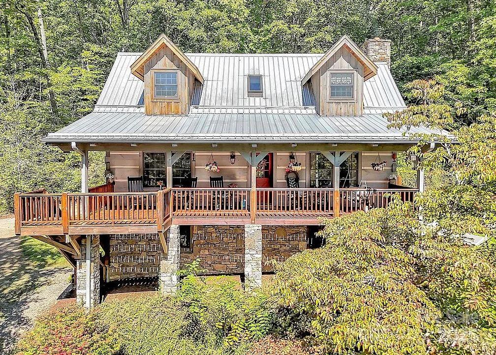 113 Mountain Cove Road Waynesville, NC 28786 - Photo 2 of 48 a front view of a house with a yard
