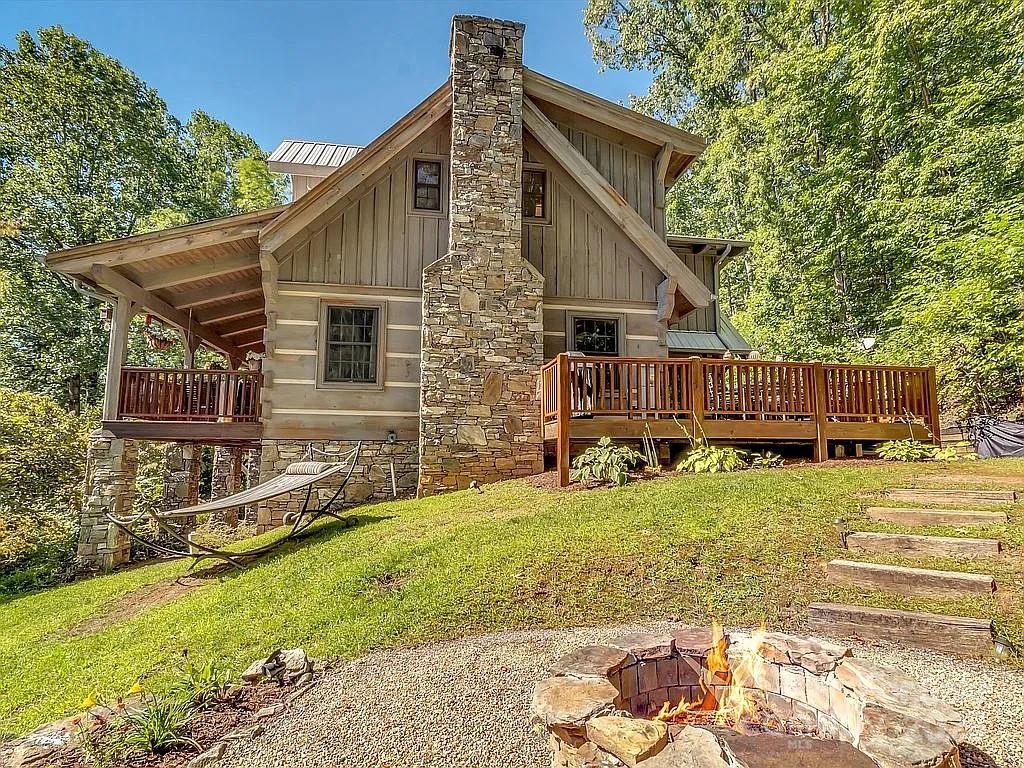 113 Mountain Cove Road Waynesville, NC 28786 - Photo 22 of 48 a view of a house with a yard