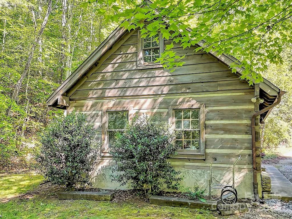 113 Mountain Cove Road Waynesville, NC 28786 - Photo 23 of 48 a view of a house with backyard