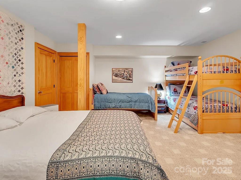 113 Mountain Cove Road Waynesville, NC 28786 - Photo 31 of 48 a bedroom with a bed and dresser