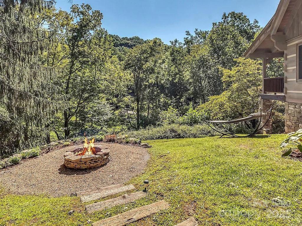 113 Mountain Cove Road Waynesville, NC 28786 - Photo 39 of 48 a view of a backyard of the house