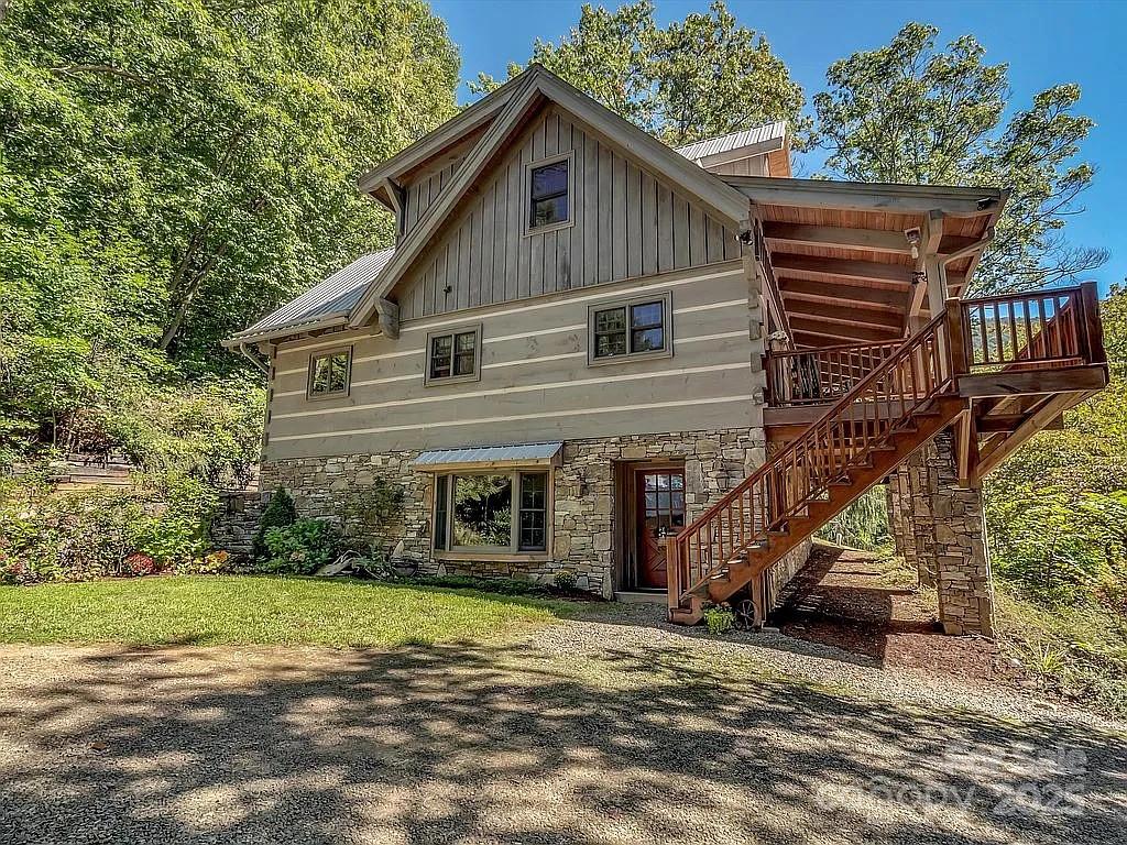 113 Mountain Cove Road Waynesville, NC 28786 - Photo 4 of 48 a view of a house with a yard