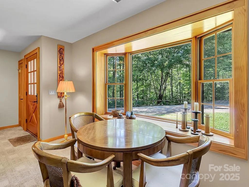 113 Mountain Cove Road Waynesville, NC 28786 - Photo 41 of 48 a dining room with furniture and window