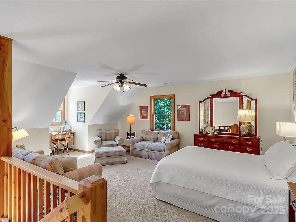 113 Mountain Cove Road Waynesville, NC 28786 - Photo 45 of 48 a bedroom with furniture and a large window
