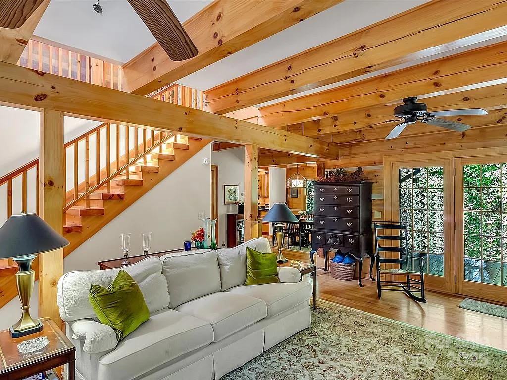 113 Mountain Cove Road Waynesville, NC 28786 - Photo 5 of 48 a living room with furniture and a large window
