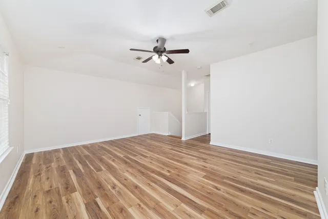 a bed room with a bed and a window