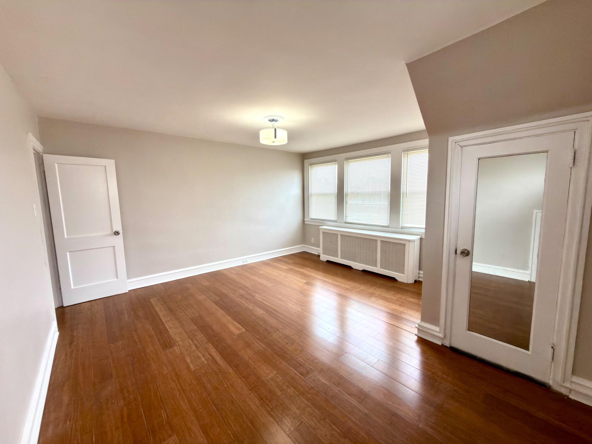 1723 Chelsea Road Elkins Park, PA 19027 - Photo 19 of 38 wooden floor in an empty room with a window