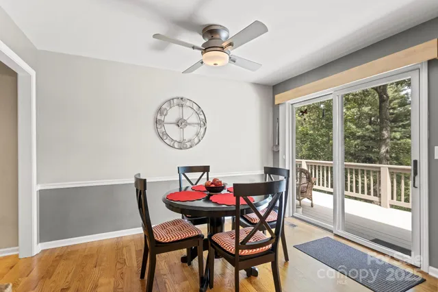 a view of a dining room with furniture window and a chandelier
