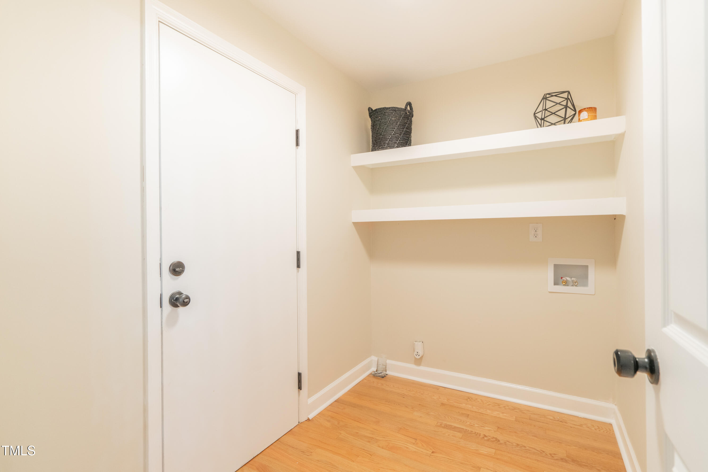 4 Timberlyne Road Chapel Hill, NC 27514 - Photo 24 of 61 Laundry room off the kitchen and breakfast area. Door leads to garage.