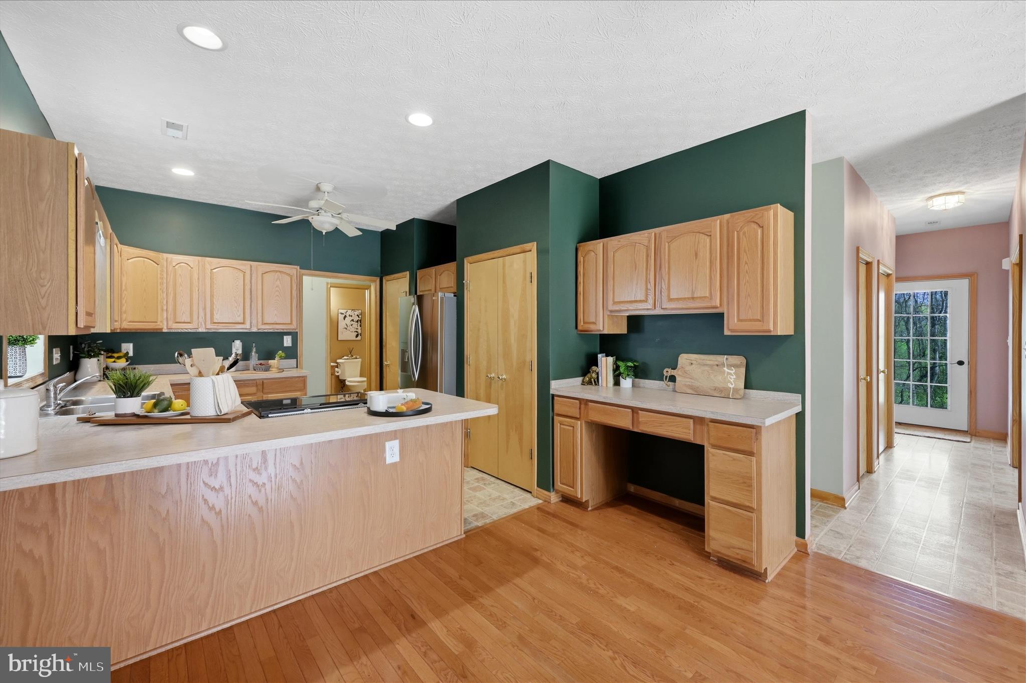 622 Co Rte 25/7 Charles Town, WV 25414 - Photo 13 of 54 a kitchen with stainless steel appliances a stove a sink and a refrigerator