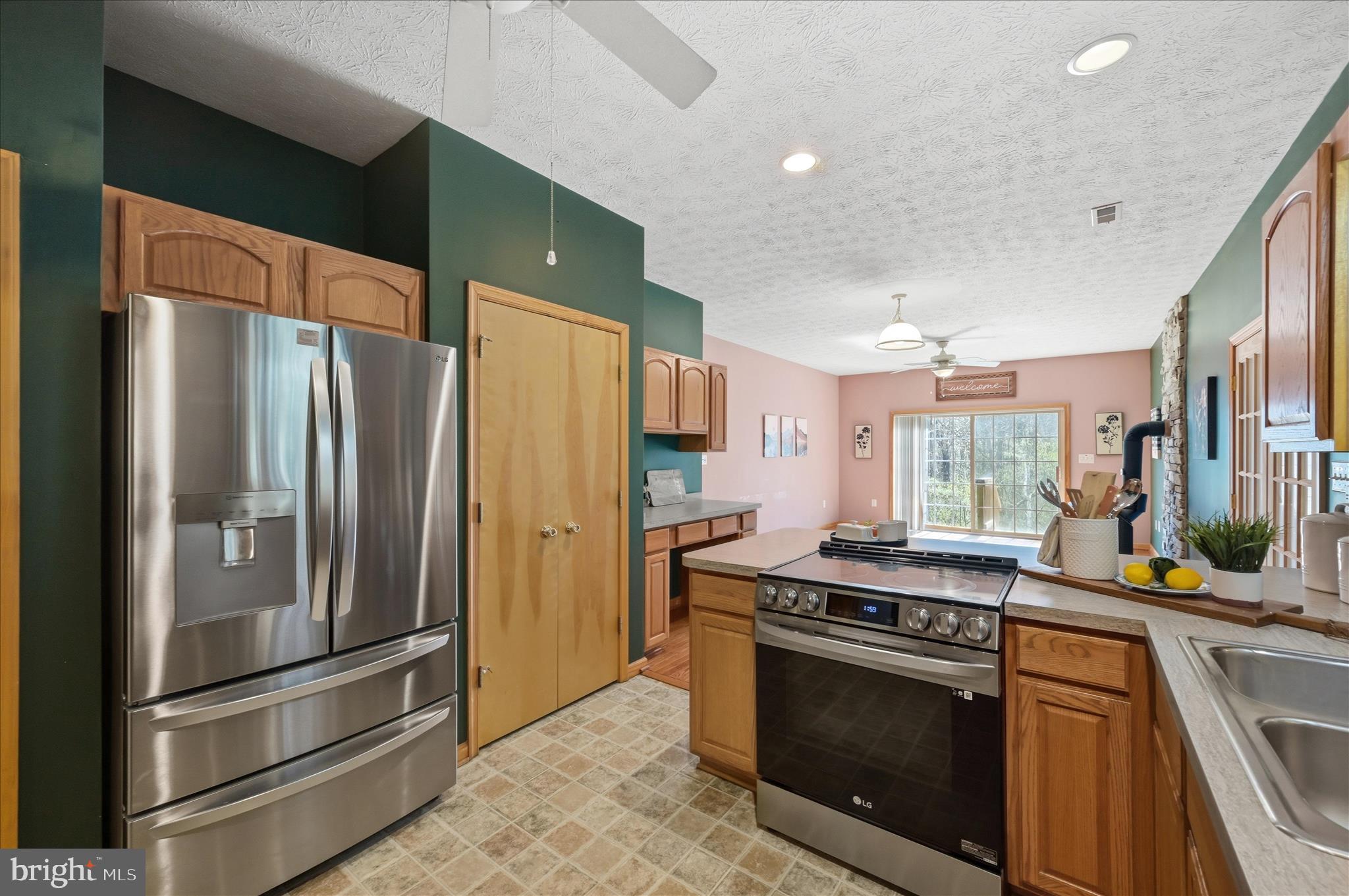 622 Co Rte 25/7 Charles Town, WV 25414 - Photo 16 of 54 a kitchen with stainless steel appliances granite countertop a stove a refrigerator and a refrigerator