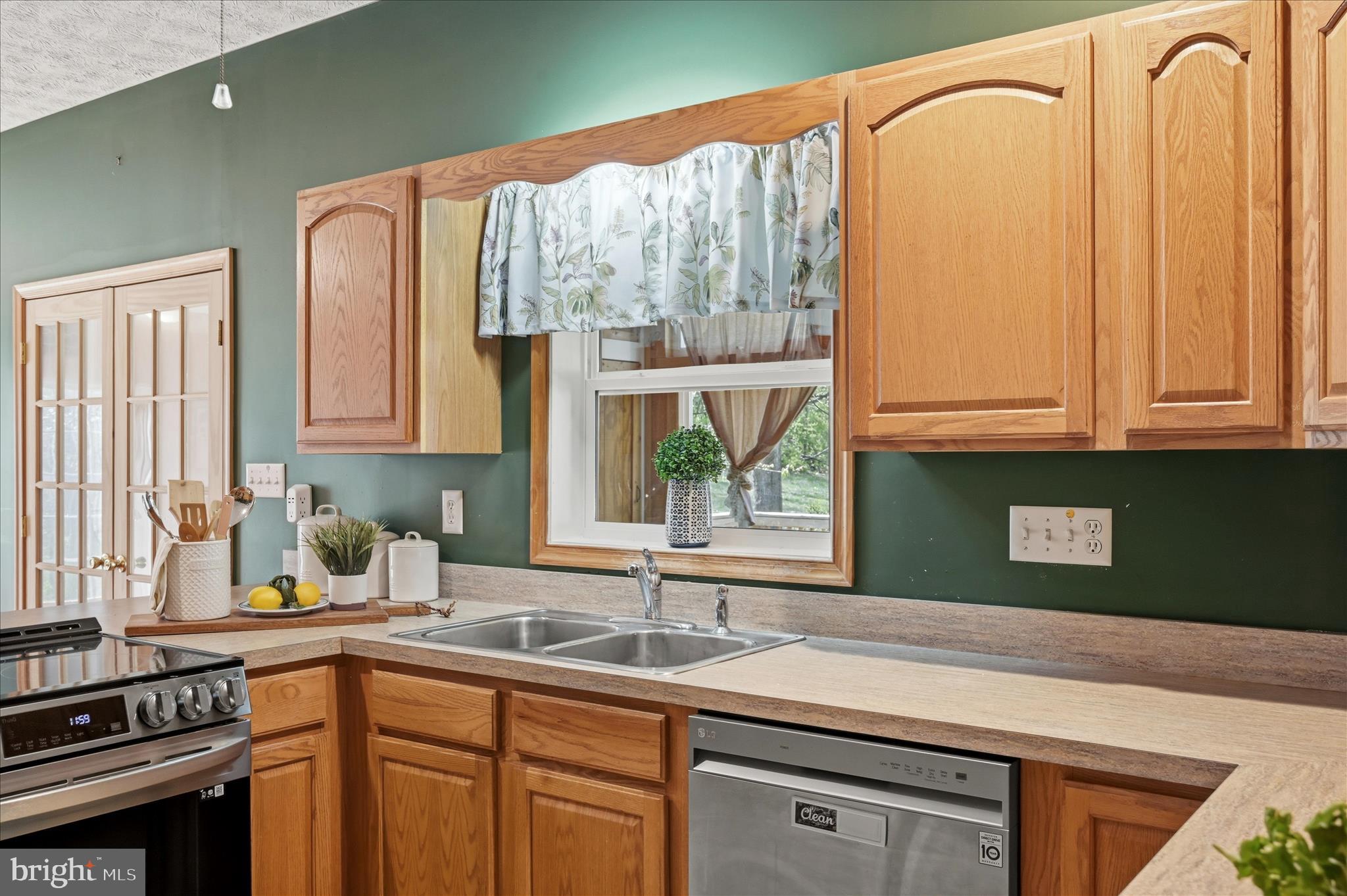 622 Co Rte 25/7 Charles Town, WV 25414 - Photo 17 of 54 a kitchen with a sink a counter top space and a window