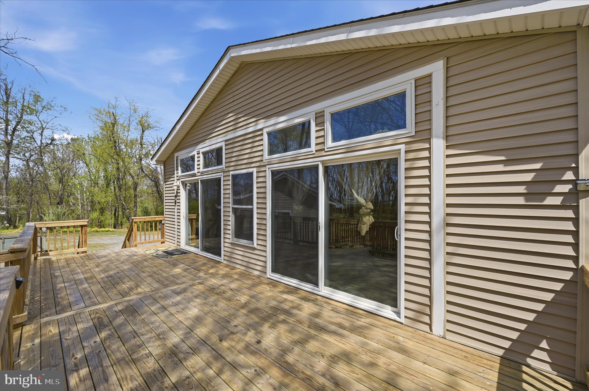 622 Co Rte 25/7 Charles Town, WV 25414 - Photo 22 of 54 a view of a house with a large window and wooden fence