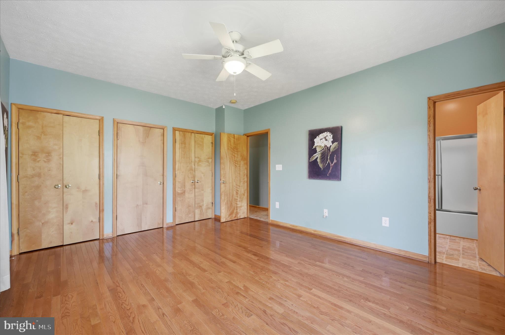622 Co Rte 25/7 Charles Town, WV 25414 - Photo 27 of 54 an empty room with wooden floor and windows