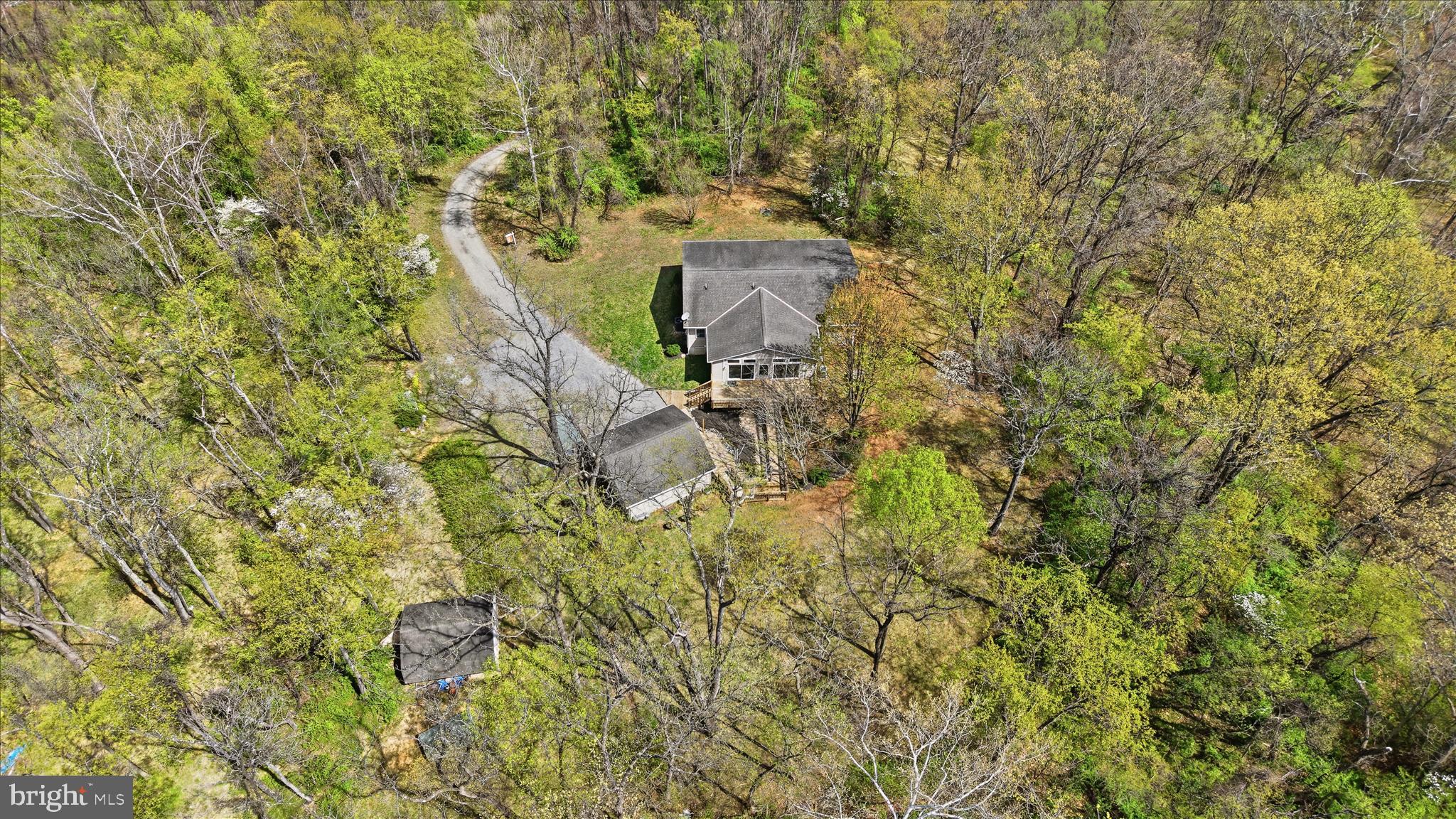 622 Co Rte 25/7 Charles Town, WV 25414 - Photo 49 of 54 a backyard of a house with large trees