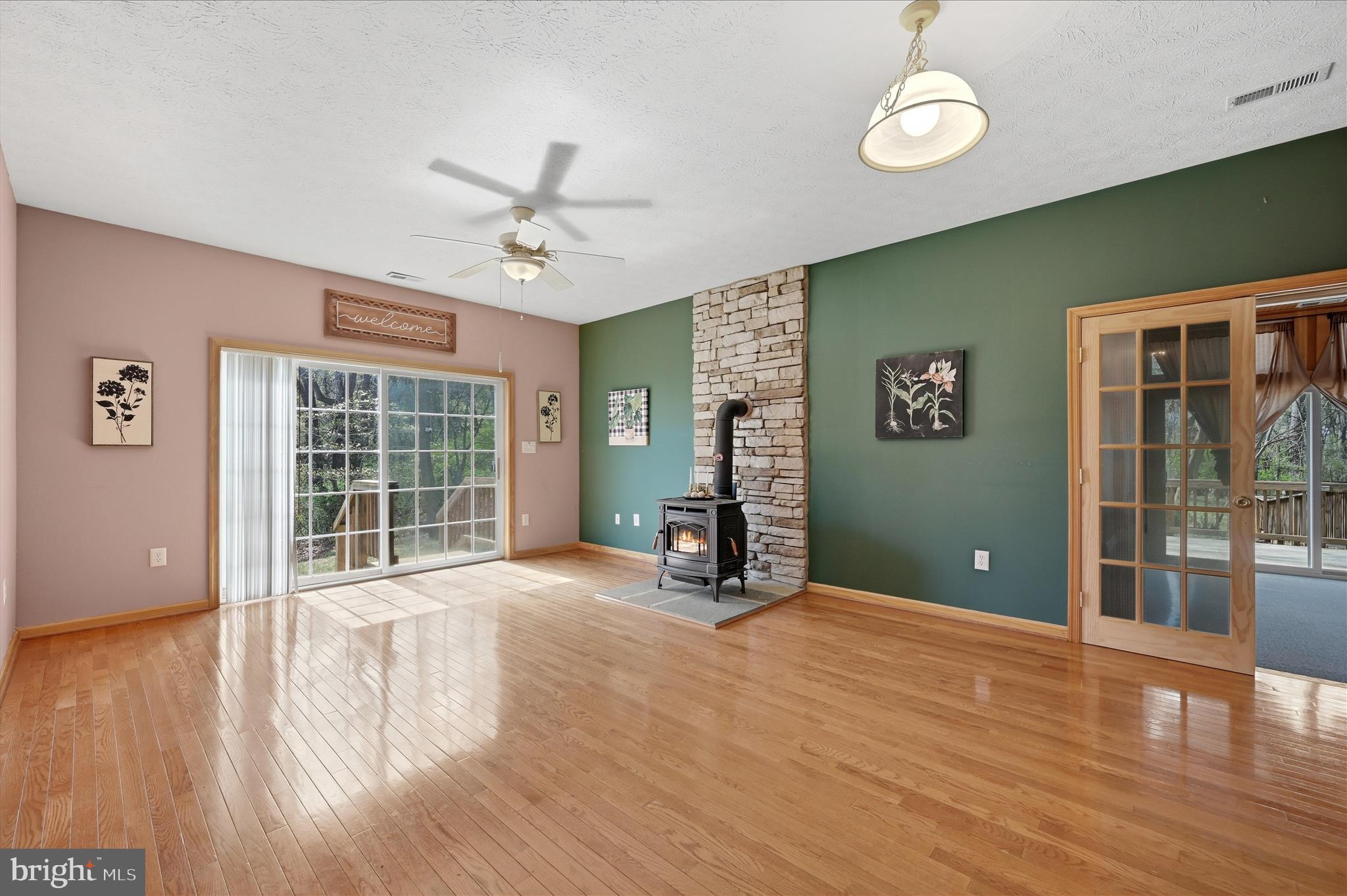 622 Co Rte 25/7 Charles Town, WV 25414 - Photo 8 of 54 a view of an empty room with wooden floor and a window