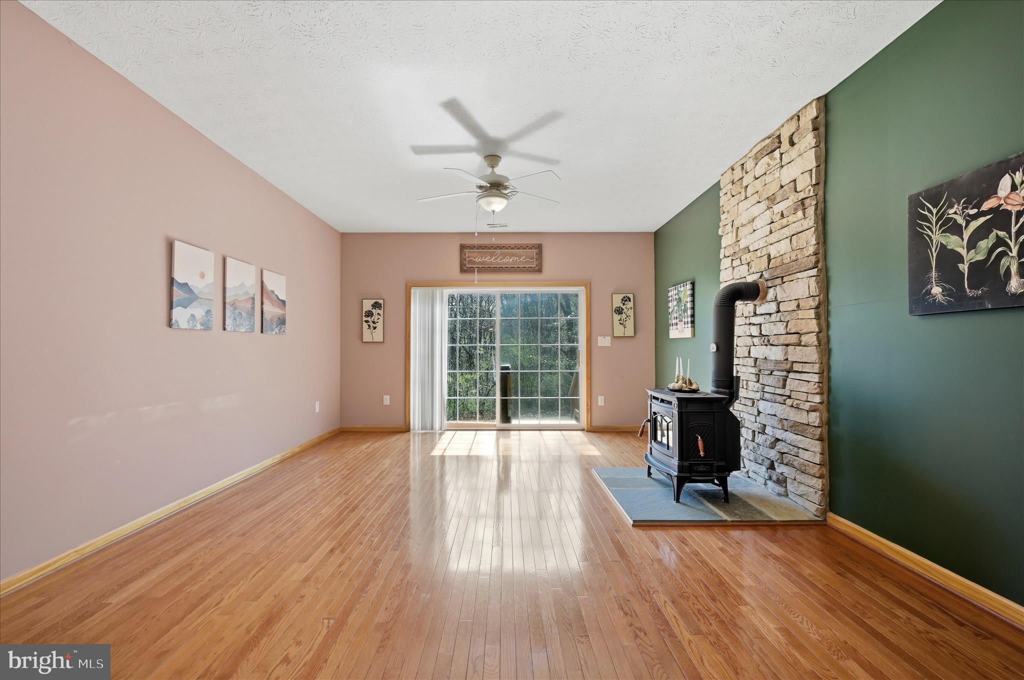 622 Co Rte 25/7 Charles Town, WV 25414 - Photo 9 of 54 a view of an empty room with a window and wooden floor