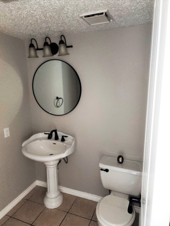2402 Chestnut Mills Road Houston, TX 77067 - Photo 7 of 11 a bathroom with a toilet sink and mirror