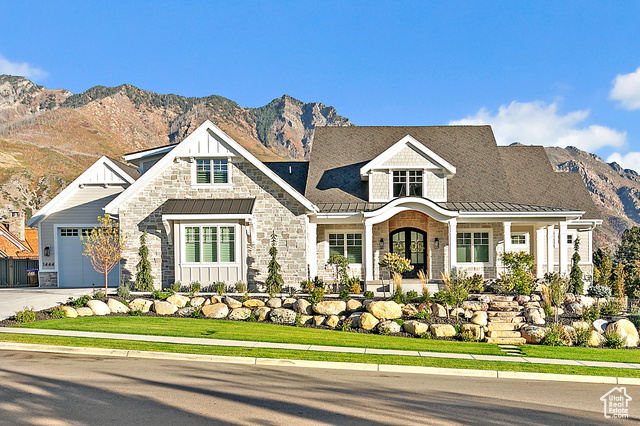 1444 North Elk Rdg Lane Alpine, UT 84004 - Photo 1 of 1 View of front of home with a standing seam roof, concrete driveway, and a mountain view
