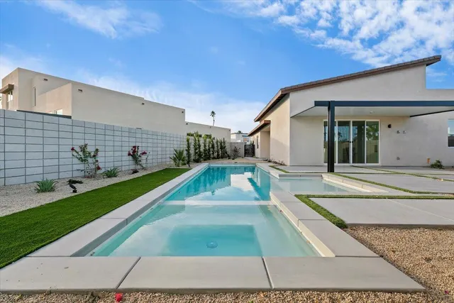 an empty room with closet and a bathroom