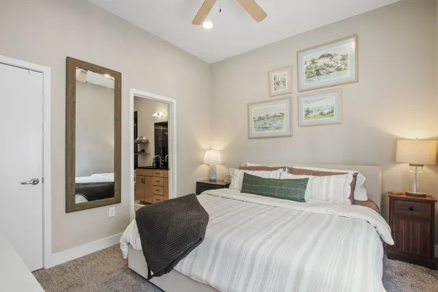 a bedroom with a bed and a view of bathroom