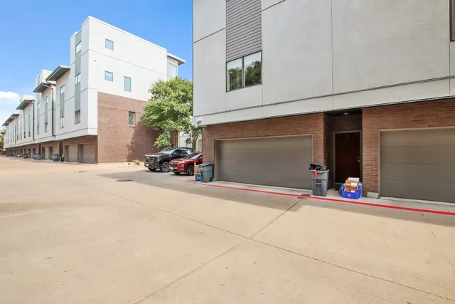 a view of a building with car parked