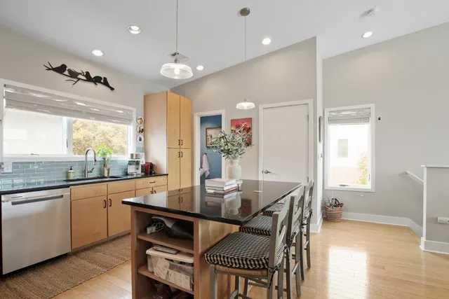 a kitchen with a table and chairs in it