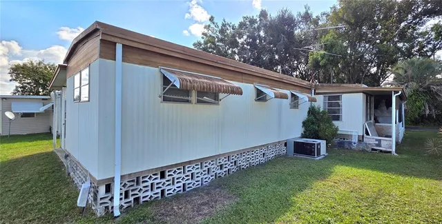 a view of a room with wooden floor and staircase