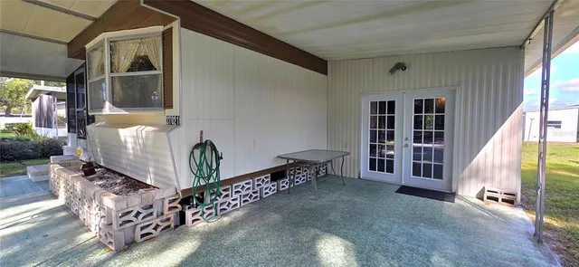 a bedroom with a bed and a table