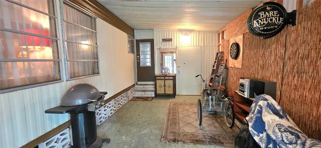 a bedroom with a bed and a mirror