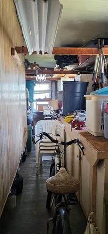 a living room with furniture a lamp and a window
