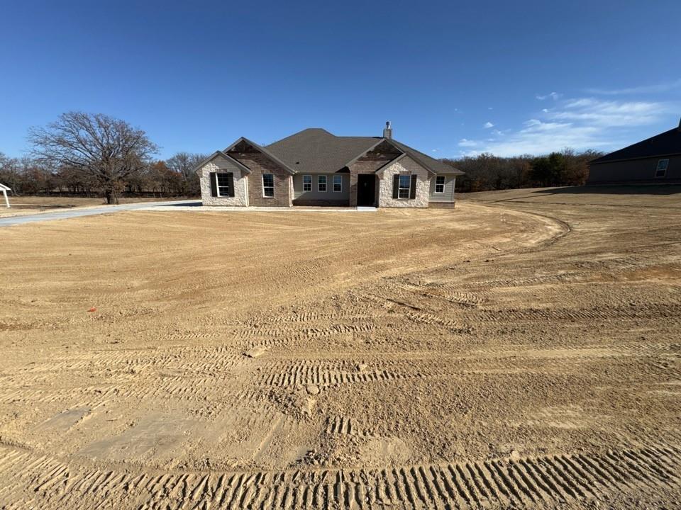 View of front of property with stone siding